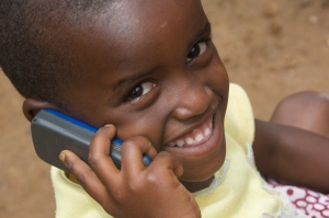Benita, 4 years old, from Ruyenzi, Rwanda uses a phone 
